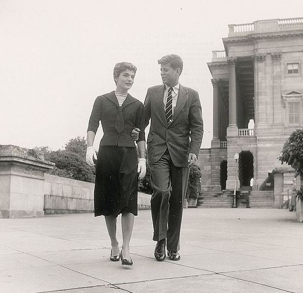 The young Senate wife and the freshman Senator walking across the West Front of the U.S. Capitol.