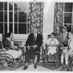 FDR with young polio patients at Warm Springs, Georgia rehabilatative cener. First Lady Eleanor Roosevelt looks on, at right.