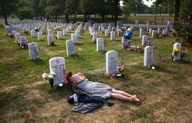Modern Memorial Day: a woman in Arlington National Cemetery mourning her fiance, killed in the Iraqi War 2007. (John Moore/Getty)