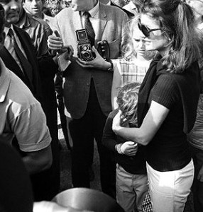 Highly protective of John, Jackie Kennedy shielded his head with her hands during a media gauntlet the day before she married Onassis.