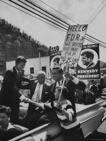 FDR, Jr. seated at far right in car with JFK campaigning in 1960.