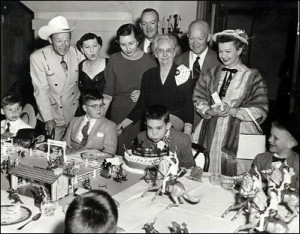 John Eisenhower stands at the back as his son David celebrates a western-theme birthday party in the White House, complete with TV cowboy actor Roy Rogers (far left) and Dale Evans (far right)