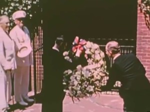 Franklin Roosevelt at far left watches as King George of England helps place wreath at Washington's Tomb, 1939.