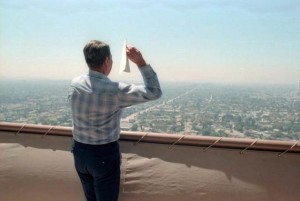 President Reagan flies a paper airplane off the roof of the Century Plaza Hotel.
