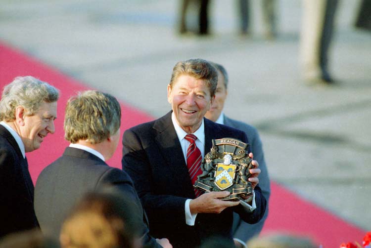 President Reagan holding his coat of arms during an Arrival Ceremony in Shannon Ireland, June 1984.