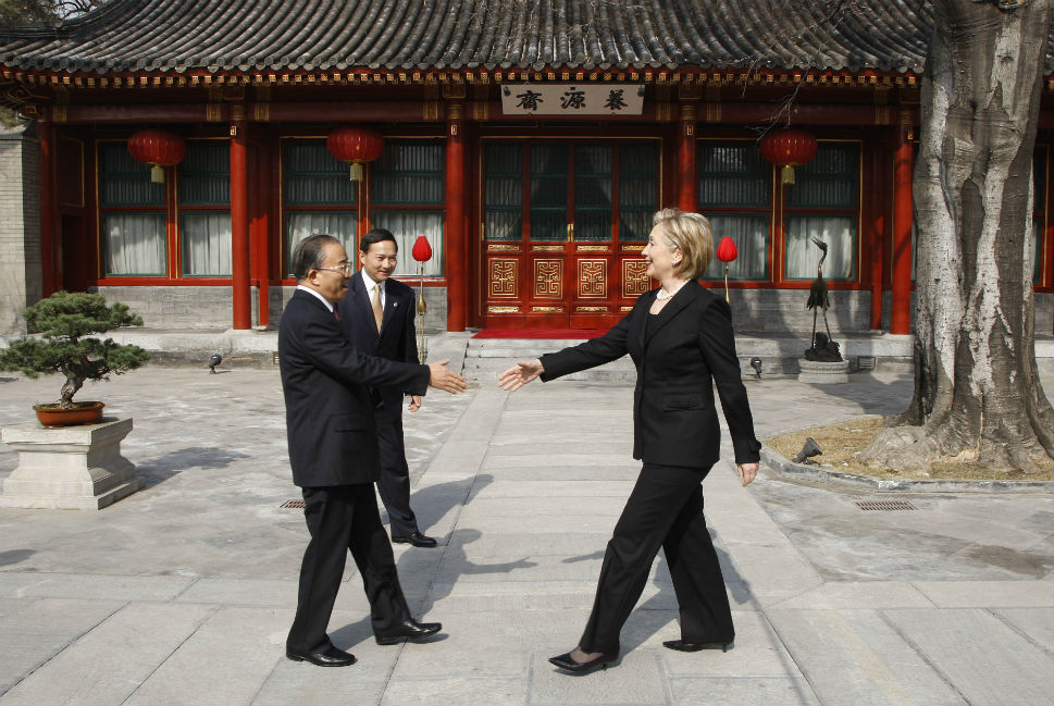 In her capacity as Secretary of State, former First Lady Hillary Clinton is greeted by Chinese State Councilor Dai Bingguo on the grounds of Beijing's Diaoyutai State Guesthouse on Feb. 21, 2009. (foreignpolicy.com)