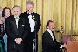President Clinton and Irish Prime Minister Albert Reynolds join in song during a State Dinner held in the latter's honor, the day after St. Patrick's Day 1994.
