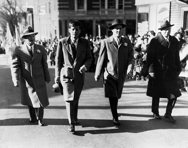 Congressional candidate John F. Kennedy walking in south Boston's St. Patrick's Day parade. (Corbis)