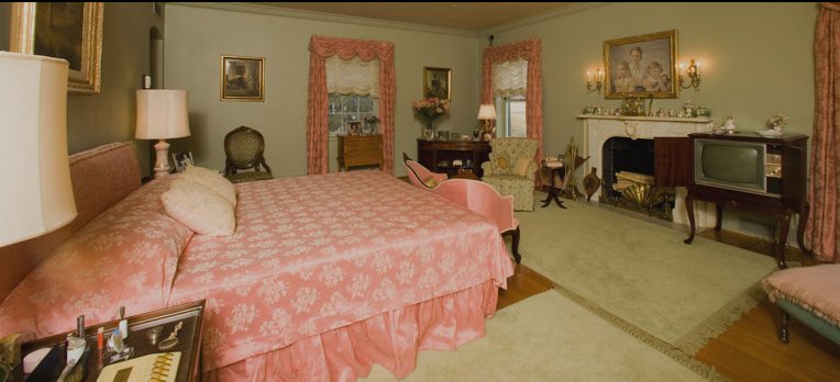 Mamie Eisenhower's legendary pink bed, in the Eisenhower farmhouse at Gettysburg, Pennsylvania. To preserve her uncertain health, she often conducted meetings and handled her correspondence from her bed.