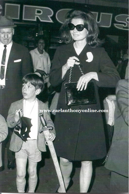 Jackie Kennedy brought John to Ringling Brothers & Barnum Bailey Circus at Madison Square Garden in 1965 and bought him a Batman mask and plastic sword. Jackie Kennedy brought John to Ringling Brothers & Barnum Bailey Circus at Madison Square Garden in 1965 and bought him a Batman mask and plastic sword.