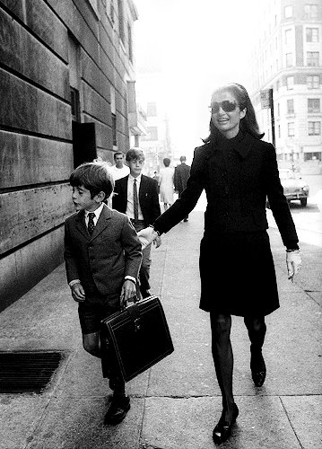 Walking her son to school, 1966. Walking her son to school, 1966.