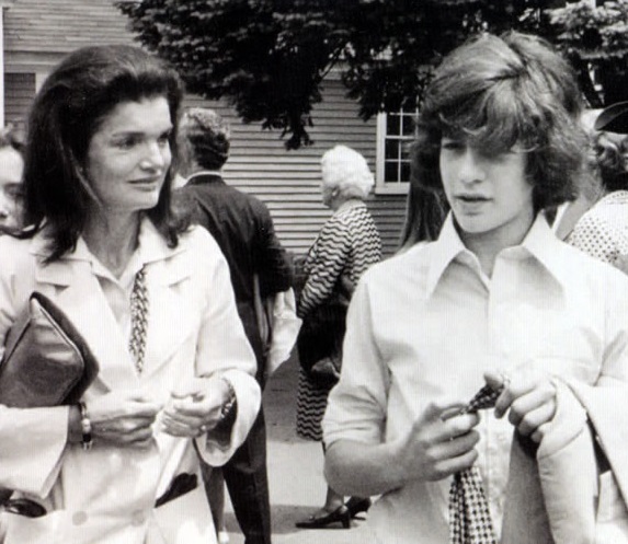 Jackie Onassis and her son following his sister's high school graduation, 1975. Jackie Onassis and her son following his sister's high school graduation, 1975.