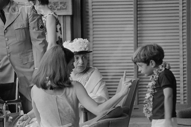The famous mother was not above reprimanding her impatient son as she reviewed a parade in Honolulu, 1966. The famous mother was not above reprimanding her impatient son as she reviewed a parade in Honolulu, 1966.