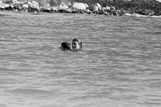 Jackie teaching her son to swim in Antigua, 1966. Jackie teaching her son to swim in Antigua, 1966.