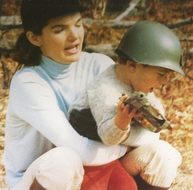 Less than two weeks before the President was killed, Jackie held her squirming son before he could continue playing soldier. Less than two weeks before the President was killed, Jackie held her squirming son before he could continue playing soldier.