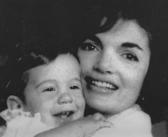 The First Lady posed with her eleven-month old son in the White House for photographer Mark Shaw. The First Lady posed with her eleven-month old son in the White House for photographer Mark Shaw.