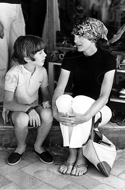 Taking a break to talk on the steps of a storefront in Athens, 1969. Taking a break to talk on the steps of a storefront in Athens, 1969.