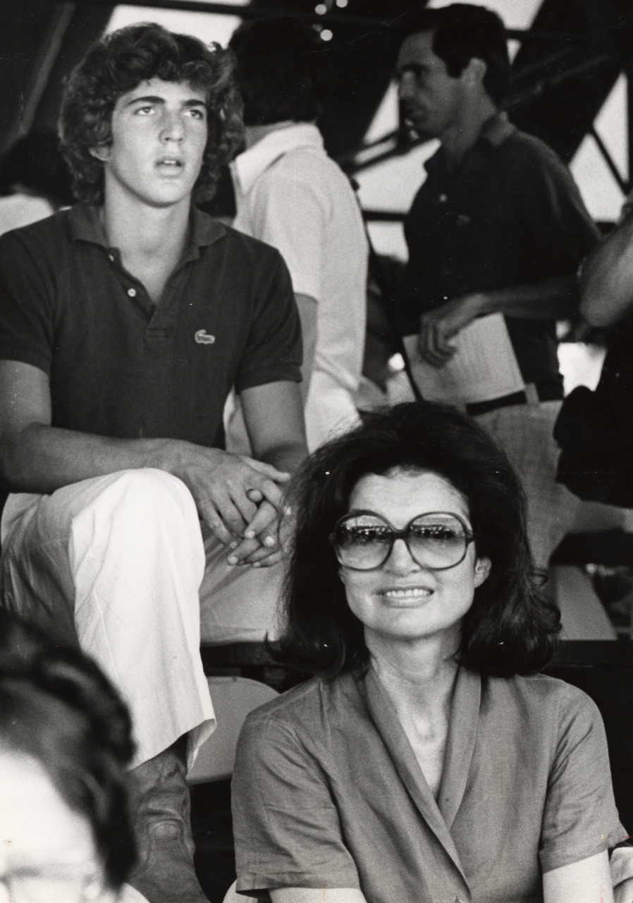 Mother and son watch a tennis match during the RFK Tennis Tournament, August 1978. Mother and son watch a tennis match during the RFK Tennis Tournament, August 1978.