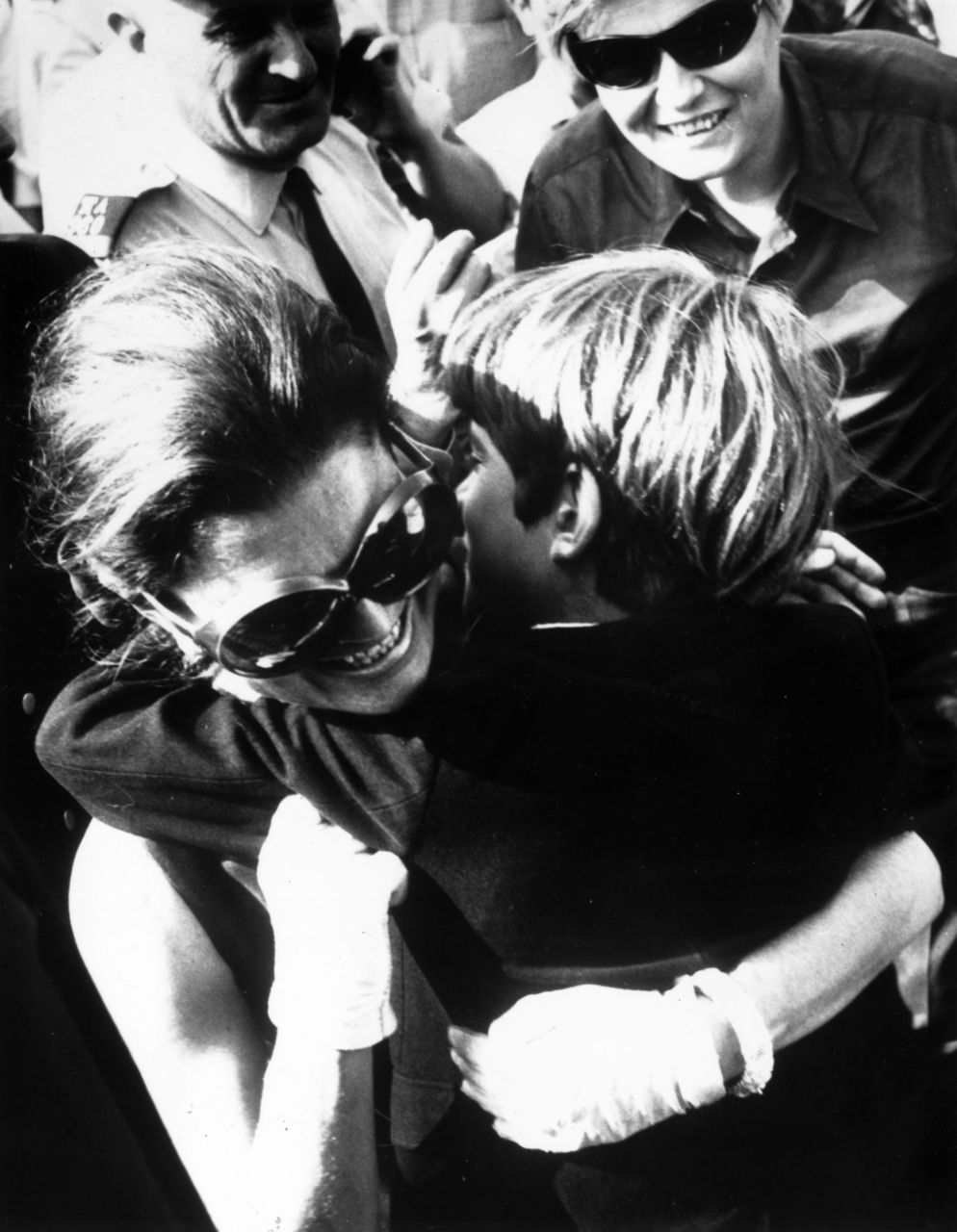 Mother and son embrace in July 1969, when John arrived at the Athens airport where she met him to begin a summer vacation in Greece. Mother and son embrace in July 1969, when John arrived at the Athens airport where she met him to begin a summer vacation in Greece.