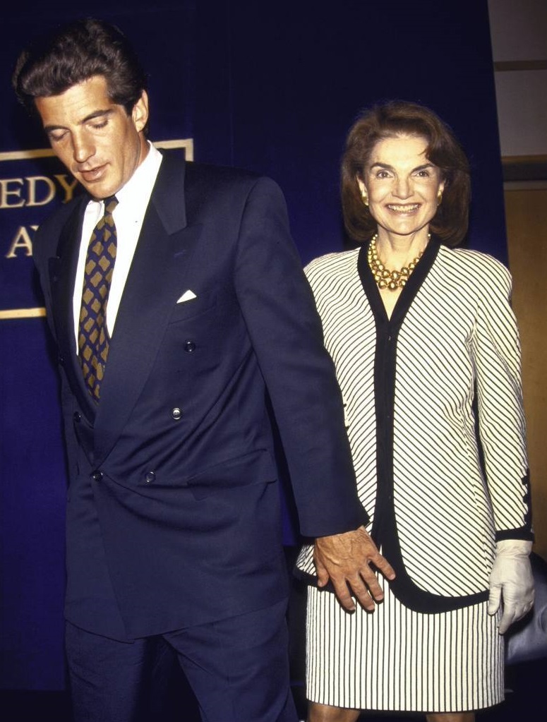 John Kennedy now leads his mother onto the stage at a 1993 ceremony honoring the late president. John Kennedy now leads his mother onto the stage at a 1993 ceremony honoring the late president.