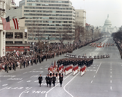 A band marching down Pennsylvania as part of hte 1965 Inaugural Parade.