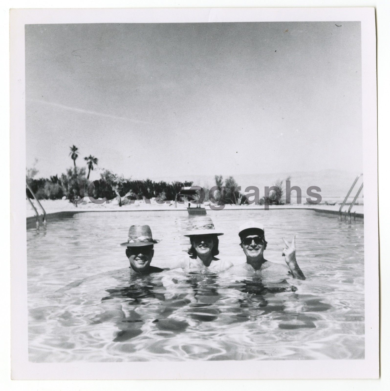 President Kennedy, at left, with his sister Pat Lawford and aide Dave Powers in the Palm Springs, California pool of actor Bing Crosby.