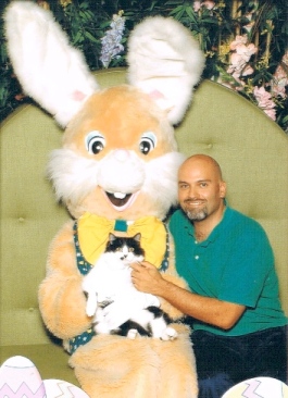 This gentleman inexplicably felt compelled to introduce his cat to the Easter Bunny,