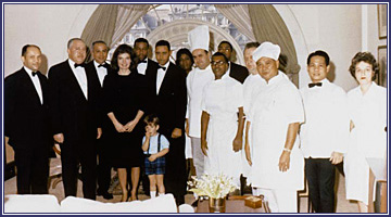 Jacqueline Kennedy and John Kennedy, Jr. posing with White House household staff members the day they moved out of the mansion.