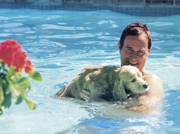 George H. Bush with family dog C. Fred in the Kennebunkport pool.