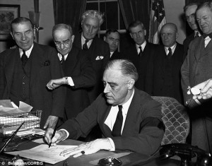 Pictures showing FDR sign  the declaration of war attracted attention for the fact that he wore a black mourning arm band for his mother.