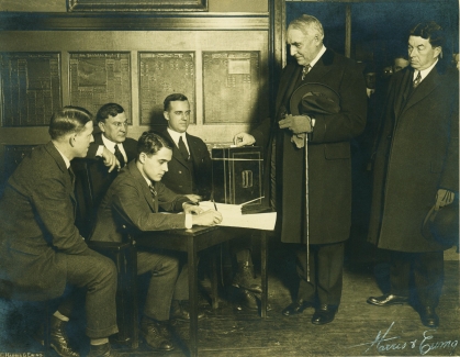 Warren G. Harding politely pauses as the vetoer registration for Marion, Ohio is checked, 1920. He's the only man elected President on his birthday, November 2. 