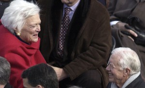 At the 2001 inauguration of her son George W., Barbara Bush made her way through the crowds on the podium to warmly greet Jimmy Carter.