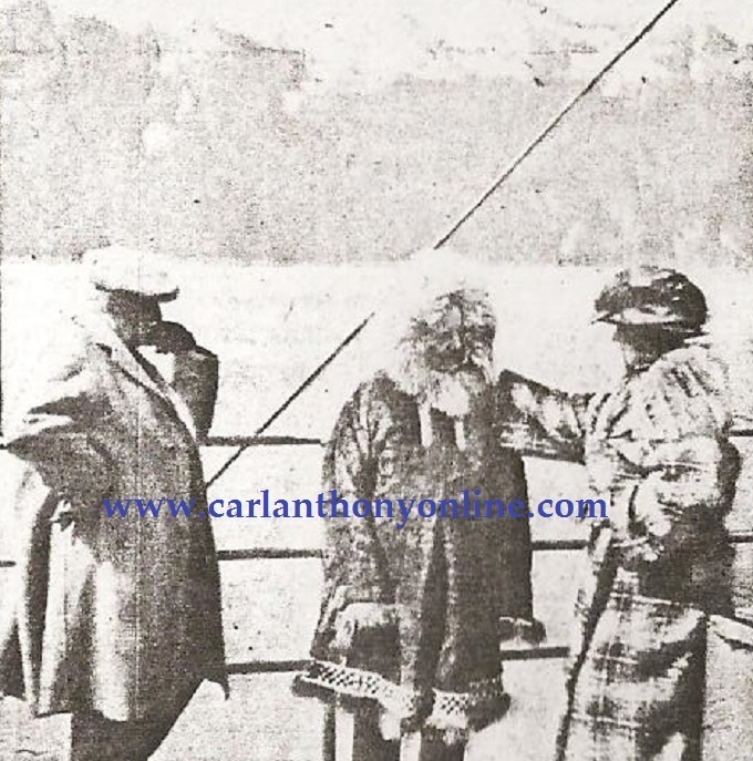 Alaska Governor Bone broke up the monotony of watching glaciers fall into the water by modeling an Eskimo parka for the President and Mrs. Harding.