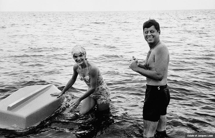 Jack Kennedy frolics in the sea with Jackie, snapped by Jacques Lowe. 