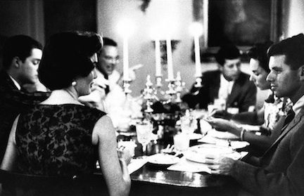 Jacqueline Kennedy in her favorite role: hosting an intimate dinner party with stimulating guests and intimate friends, seen seated here with Robert and Ethel Kennedy, and Lem Billings among others.