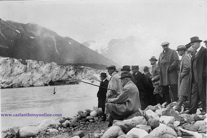 President Harding and his party sit in silence, watching glaciers collapse into the sea at Cordova.