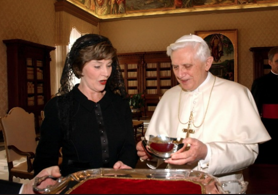 Laura Bush accepts Pope Benedict's state gift to the United States, presented in his papal reception room, 2006.