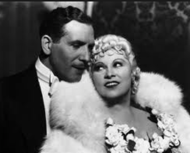 Looking him over something good: Paul Cavanaugh and Mae West, 1935.