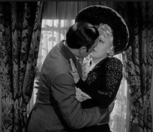 Hang on buddy: Joseph Calleia tries to squeeze a kiss out of Mae West in 1940's My Little Chickadee.