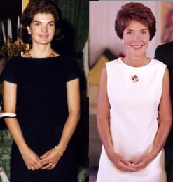 Jackie and Nancy standing and clasping alike.