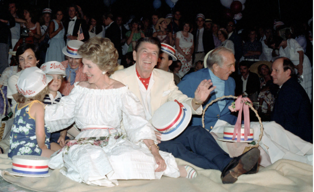 The President helped make Nancy Reagan's first Fourth of July birthday as First Lady a relief from her anxieties. They take in fireworks with friends on the White House South Lawn, 1`981. (RRPL)