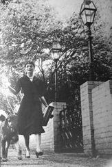 Jackie Kennedy heads out for a day of errands with her poodle Gaullie.