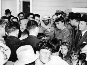 Mrs. Roosevelt speaking with migrant workers at the FSA Farmersville Camp, California.