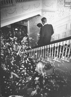 The newlyweds Jack and Jackie Kennedy leaving their wedding reception, heading out to begin their honeymoon.