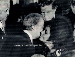 Jimmy Carter kissing actress Liz Taylor at a June 30, 1976 fundraiser for his presidential campaign, held in New York's Waldorf-Astoria Hotel.
