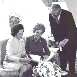 One of the smoothest First Lady transitions took place in December 1968, when Lady Bird Johnson gave the tea and tour for her old Senate wife colleague Pat Nixon; they're seen here reviewing the floor plans of the mansion with Chief Usher J.B. West.