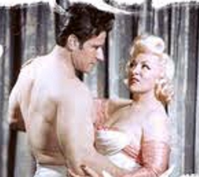 In a mutual hold, muscleman Mae West and Paul Novak (then using the stage name of Chuck Krauser). She was the woman he loved who would never marry him for 26 years. (maewest.nl.com)