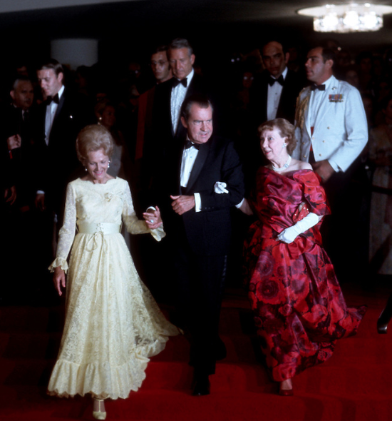 President Nixon escorts his wife Pat and former First Lady Mamie Eisenhower after a performance at the opening of the John F. Kennedy Center for the Performing Arts, 1971.