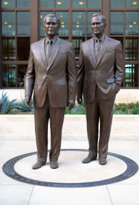 Statues of both Bushes in front of the W. Bush presidential library.