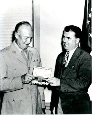 Weeks presents his proposal for a National Veterans Day to General Eisenhower.